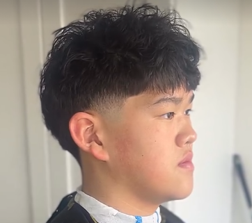 Freehand hair design on a textured cut, back view
